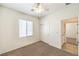 Bedroom featuring neutral walls, carpet, a closet and an ensuite bathroom at 2550 Evening Twilight Ave, Henderson, NV 89044