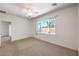 Spacious bedroom featuring a ceiling fan, window and neutral color palette at 2550 Evening Twilight Ave, Henderson, NV 89044