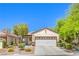 Charming single-story home with a well-manicured front yard and a two-car garage at 2550 Evening Twilight Ave, Henderson, NV 89044