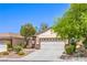 Inviting home featuring desert landscaping and a two-car garage at 2550 Evening Twilight Ave, Henderson, NV 89044