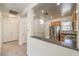 Charming kitchen with stainless steel refrigerator, ample storage, and open access to the hallway at 2550 Evening Twilight Ave, Henderson, NV 89044