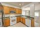 Open kitchen featuring stainless steel appliances, a breakfast bar, and view of the adjacent living area at 2550 Evening Twilight Ave, Henderson, NV 89044