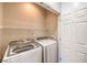Bright laundry room featuring modern Samsung washer and dryer units and a wire shelf at 2550 Evening Twilight Ave, Henderson, NV 89044