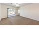 Bright living room featuring sliding door access to the outdoor space, offering natural light and ventilation at 2550 Evening Twilight Ave, Henderson, NV 89044