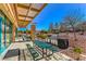 Enjoy outdoor dining with picnic tables, built-in grills, and a landscaped backdrop at 2550 Evening Twilight Ave, Henderson, NV 89044