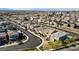 A neighborhood shot with many two story homes on a sunny day, with mountains in the background at 2628 Ferrara St, Henderson, NV 89044
