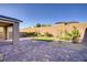 Private backyard oasis featuring a brick patio, low maintenance landscaping, and privacy wall at 2628 Ferrara St, Henderson, NV 89044