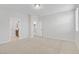 Spacious bedroom with carpeted floors, with entryways to bathroom and hallway at 2628 Ferrara St, Henderson, NV 89044