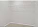 Walk-in closet featuring wire shelving and plush carpet at 2628 Ferrara St, Henderson, NV 89044