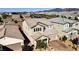 Beautiful two-story home featuring a neutral color palette, desert landscaping, and a tile roof at 2628 Ferrara St, Henderson, NV 89044