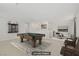Staged game room featuring a pool table, wall decor, and comfortable seating at 2628 Ferrara St, Henderson, NV 89044