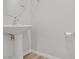 Stylish half bath with pedestal sink and modern fixtures at 2628 Ferrara St, Henderson, NV 89044