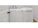 Well-lit laundry room with a new washer and dryer at 2628 Ferrara St, Henderson, NV 89044