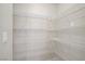 Spacious walk-in pantry with multiple wire shelves for organized storage at 2628 Ferrara St, Henderson, NV 89044
