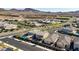 Wide shot of a clean neighborhood featuring two story homes with the desert mountains in the background at 2628 Ferrara St, Henderson, NV 89044
