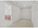 Walk-in closet with built in shelving and carpet flooring with easy access to the bathroom at 2628 Ferrara St, Henderson, NV 89044