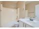 Bathroom with a shower-tub combo and a large vanity at 2668 Ivoryhill St, Las Vegas, NV 89135