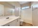 This bathroom features a shower and tub combination, white vanity, and a large mirror at 2668 Ivoryhill St, Las Vegas, NV 89135