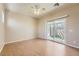 Bright bedroom featuring hardwood floors, slider to patio, and neutral color scheme at 2668 Ivoryhill St, Las Vegas, NV 89135