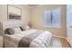 Cozy bedroom with a comfortable bed, shuttered window and stylish decor at 2668 Ivoryhill St, Las Vegas, NV 89135