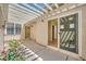 Bright bedroom with hardwood floors, access to private patio, and neutral color scheme at 2668 Ivoryhill St, Las Vegas, NV 89135