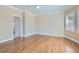 Bright bedroom featuring wood floors, large windows, and a ceiling fan at 2668 Ivoryhill St, Las Vegas, NV 89135