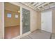 Bright bedroom with hardwood floors, ceiling fan, and sliding door access to private patio at 2668 Ivoryhill St, Las Vegas, NV 89135