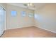 Bright bedroom featuring a ceiling fan, hardwood floors, and multiple windows for natural light at 2668 Ivoryhill St, Las Vegas, NV 89135