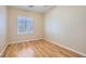 Bedroom with wood floors, neutral walls, and a shuttered window at 2668 Ivoryhill St, Las Vegas, NV 89135