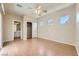 Bright bedroom with hardwood floors, closet, and three horizontal windows for natural light at 2668 Ivoryhill St, Las Vegas, NV 89135