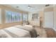 Comfortable bedroom with shutters, ceiling fan, and modern furniture on hardwood floors at 2668 Ivoryhill St, Las Vegas, NV 89135