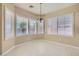 Bright dining area featuring plantation shutters, chandelier, and tile flooring at 2668 Ivoryhill St, Las Vegas, NV 89135