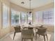 Charming dining area with plantation shutters, dining table, and sophisticated decor at 2668 Ivoryhill St, Las Vegas, NV 89135
