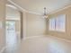 Bright dining area with tile floors, neutral walls and view into the backyard pool at 2668 Ivoryhill St, Las Vegas, NV 89135