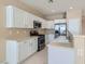 Beautiful kitchen featuring white cabinets, stainless steel appliances, and tile flooring at 2668 Ivoryhill St, Las Vegas, NV 89135