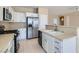 Well-equipped kitchen featuring white cabinets and stainless steel appliances at 2668 Ivoryhill St, Las Vegas, NV 89135