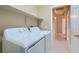 Laundry room featuring a washer, a dryer, and storage shelving at 2668 Ivoryhill St, Las Vegas, NV 89135