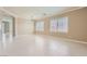 Bright living area featuring tile floors, base molding, natural light, and neutral paint at 2668 Ivoryhill St, Las Vegas, NV 89135