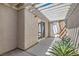 Charming outdoor patio area with a pergola-covered area and desert landscaping at 2668 Ivoryhill St, Las Vegas, NV 89135