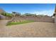 Expansive brick patio in the backyard with lush artificial turf, beautiful landscaping, and plenty of privacy at 281 Gandara St, Las Vegas, NV 89138