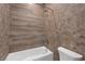 Nicely appointed bathroom showcasing textured accent tile around the tub and toilet at 281 Gandara St, Las Vegas, NV 89138