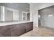 This contemporary bathroom features a dual sink vanity and glass-enclosed shower at 281 Gandara St, Las Vegas, NV 89138