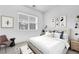Serene bedroom featuring a plush bed, minimalist decor, and natural light at 281 Gandara St, Las Vegas, NV 89138