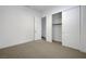 Neutral-toned bedroom featuring closet, carpet, and white painted walls and trim at 281 Gandara St, Las Vegas, NV 89138