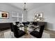 Elegant dining room featuring stylish furnishings and a modern lighting fixture at 281 Gandara St, Las Vegas, NV 89138