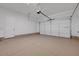 Spacious two-car garage with epoxy flooring, providing ample space for parking and storage at 281 Gandara St, Las Vegas, NV 89138