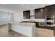 Modern kitchen featuring stainless steel appliances, a large island, and contemporary design at 281 Gandara St, Las Vegas, NV 89138