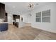 Open layout with kitchen island, stainless steel appliances, and modern lighting fixtures at 281 Gandara St, Las Vegas, NV 89138
