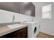 Functional laundry room featuring modern washer/dryer and ample cabinet space at 281 Gandara St, Las Vegas, NV 89138