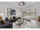 Modern living room with a comfortable sofa, stylish decor, and access to the outdoor patio at 281 Gandara St, Las Vegas, NV 89138
